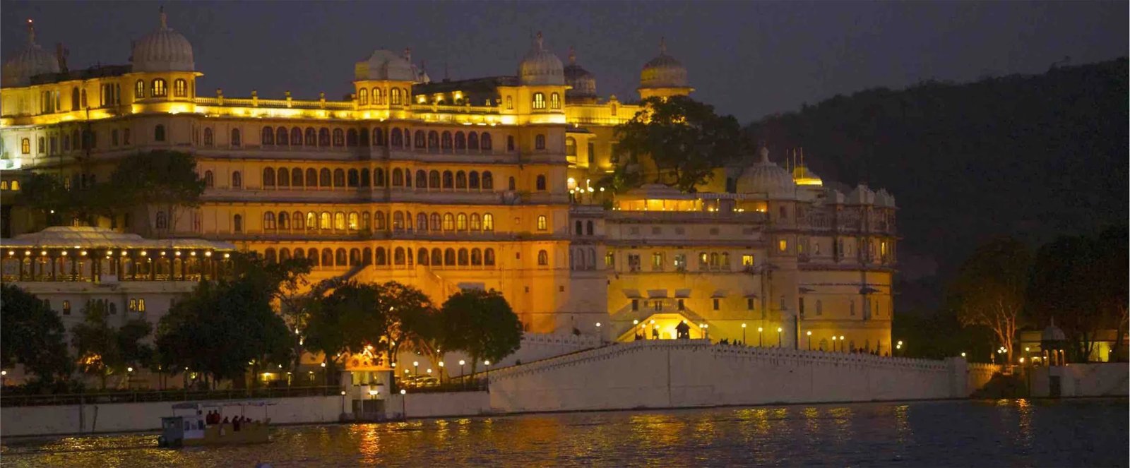 Royal Baraat procession arriving at palace wedding gates in Udaipur