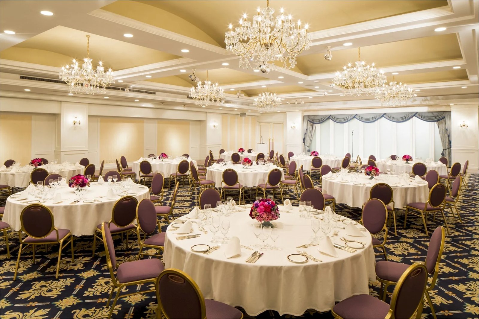 Evening wedding reception gala with banquet lighting and celebration tables