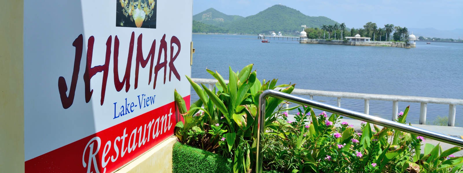 Official Jhumar Lake-View Restaurant signboard and entrance terrace on Rani Road, Udaipur